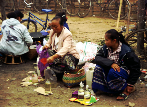 laos - selling rice whiskey.jpg